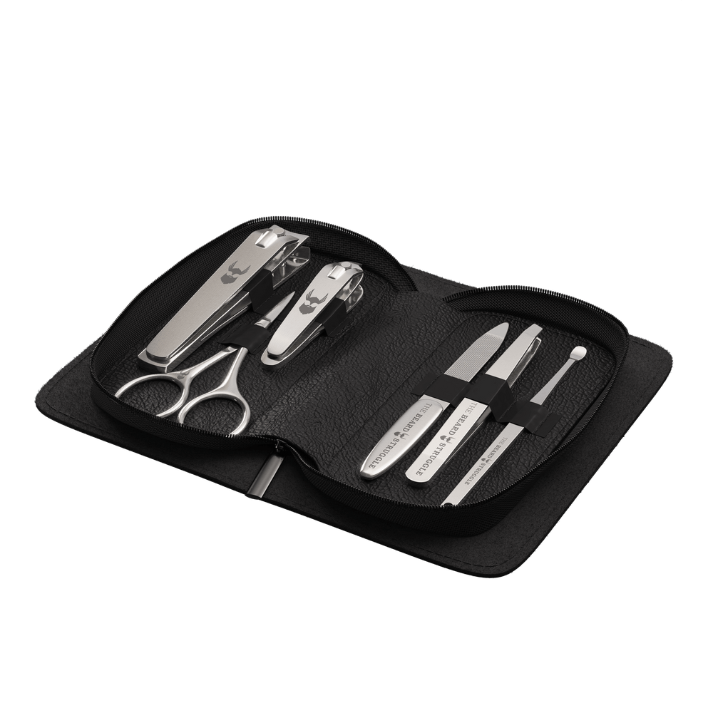 Dieses kompakte Set enthält hochwertige Haarschneider, Scheren, eine Nagelfeile, Pinzetten und ein Ohrenstäbchen
